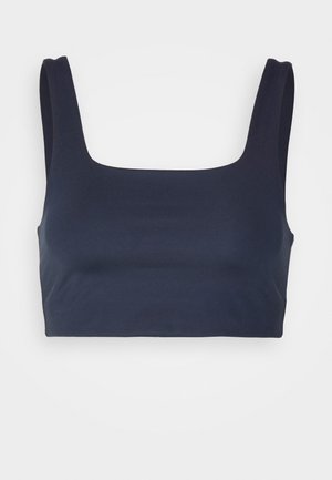 Dark navy crop top with a square neckline, wide shoulder straps, and smooth, stretchy fabric. No visible patterns or hardware details.