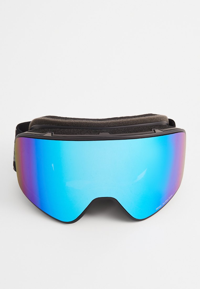 Gogle narciarskie z zakrzywioną, szeroką soczewką w niebieskim odcieniu, z gradientem przechodzącym od niebieskiego do purpurowego. W zestawie czarna pianka amortyzująca oraz regulowany pasek.