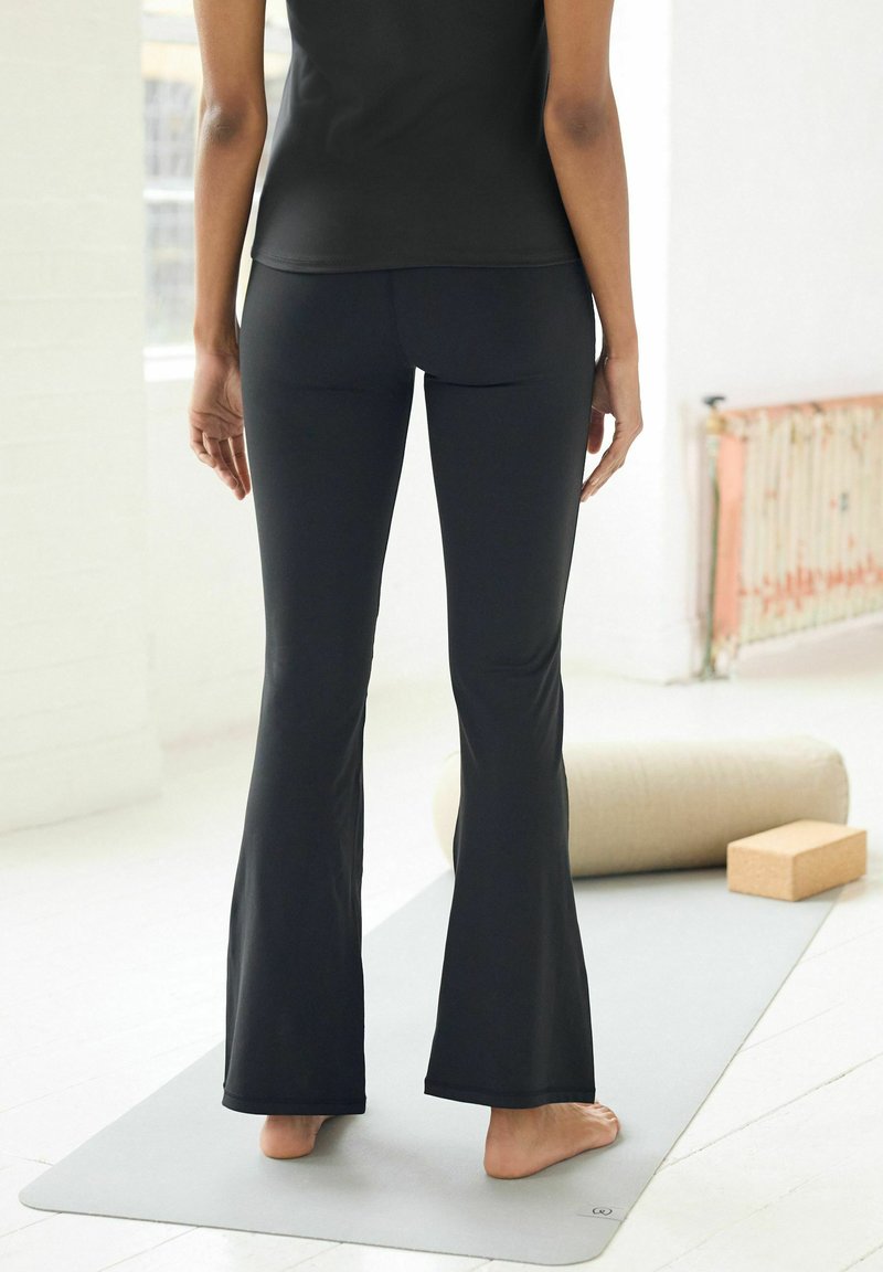Next RIBBED YOGA - Trikoot - black kickflare
