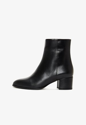 Black leather ankle boot with a smooth finish, rounded toe, and a mid-height block heel. Simple design with no notable accents or patterns.