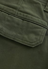 Next SLIM FIT STRETCH - Oldalzsebes nadrágok - mottled dark green