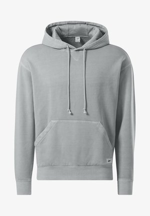 Ljusgrå hoodie i mjukt tyg. Har dragsko i huvan, känguruficka, ribbade muddarna och nederkant. Texturerad triangeldekoration på framsidan.