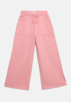 Pantaloni larghi rosa in felpa con vita elastica, coulisse, grandi tasche anteriori e sottile logo "cK" sulla tasca sinistra.