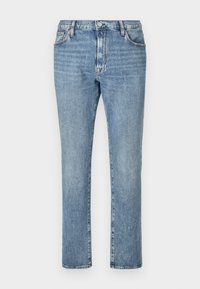 Ανοιχτό μπλε τζιν παντελόνι με ίσια γραμμή, που έχει πέντε τσέπες και κλείσιμο με κουμπί μπροστά. Μια ξεθωριασμένη υφή προσθέτει οπτικό ενδιαφέρον.