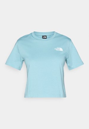 T-shirt en coton bleu clair à manches courtes et encolure ras du cou. Présente un petit logo blanc sur la poitrine et un design à coupe décontractée.