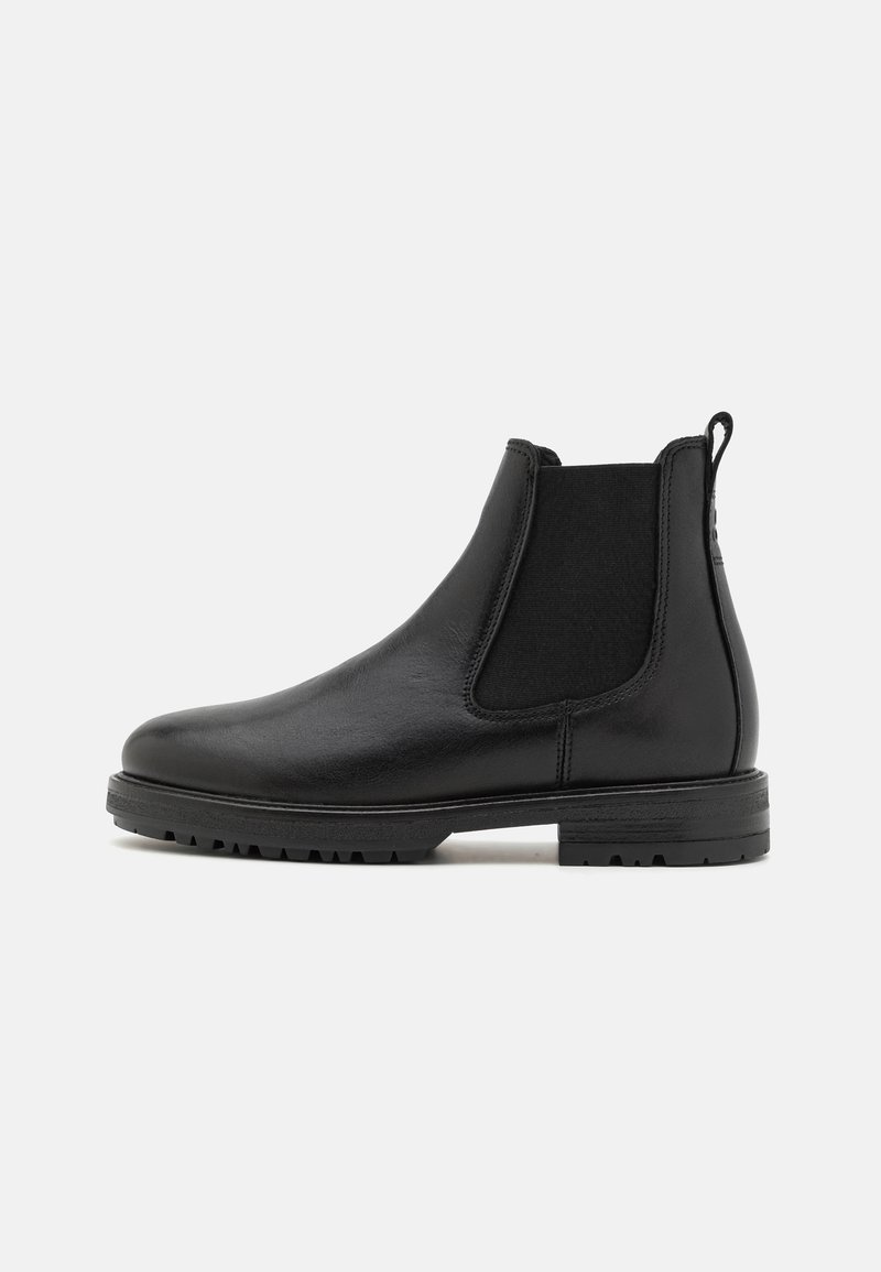 Black leather Chelsea boot with elastic side panels, textured finish, rounded toe, pull tab, and a rugged rubber sole.