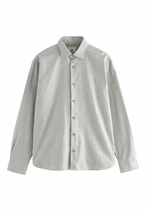 Chemise gris clair à manches longues avec un col boutonné et des boutons à l'avant. Fabriquée dans un tissu texturé avec un motif subtil sur l'ensemble.