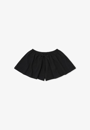 Pantalones cortos negros de pierna ancha con cinturilla elástica y un pequeño lazo frontal, colocados planos sobre un fondo blanco.