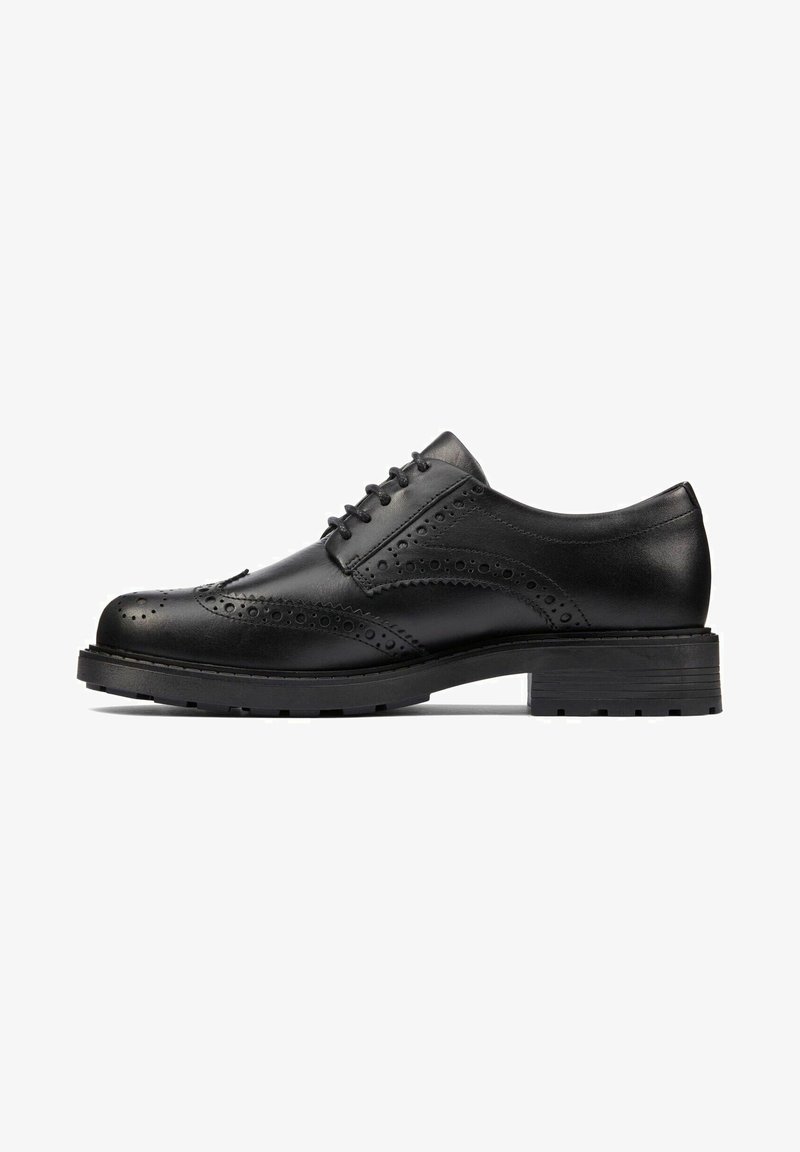 Black brogue dress shoe made of smooth leather, featuring perforated detailing, rounded toe, and a sturdy rubber sole.