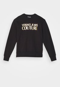 Černá mikina s dlouhým rukávem se zlatým logem „VERSACE JEANS COUTURE“ uprostřed na hrudi, kulatým výstřihem a přiléhavými manžetami.