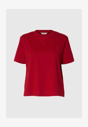 Röd bomullströja med rund halsringning, korta ärmar och avslappnad passform. Slät yta utan synliga mönster eller dekorationer.