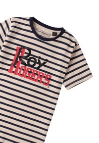 Camiseta a rayas en color crema con rayas horizontales en azul marino. Presenta un atrevido estampado gráfico en negro y rojo en la parte frontal. Mangas cortas, cuello redondo.