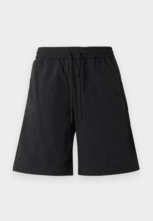 Shorts noirs en tissu léger avec une surface texturée, dotés d'une taille élastique et de cordons de serrage pour un ajustement réglable.