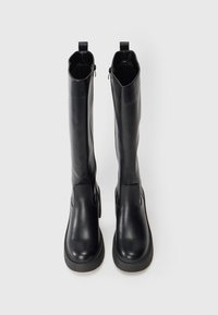 Black leather knee-high boots with a smooth texture, rounded toe, side zip closure, and rear pull tab for easy wear. Slim, sleek design.