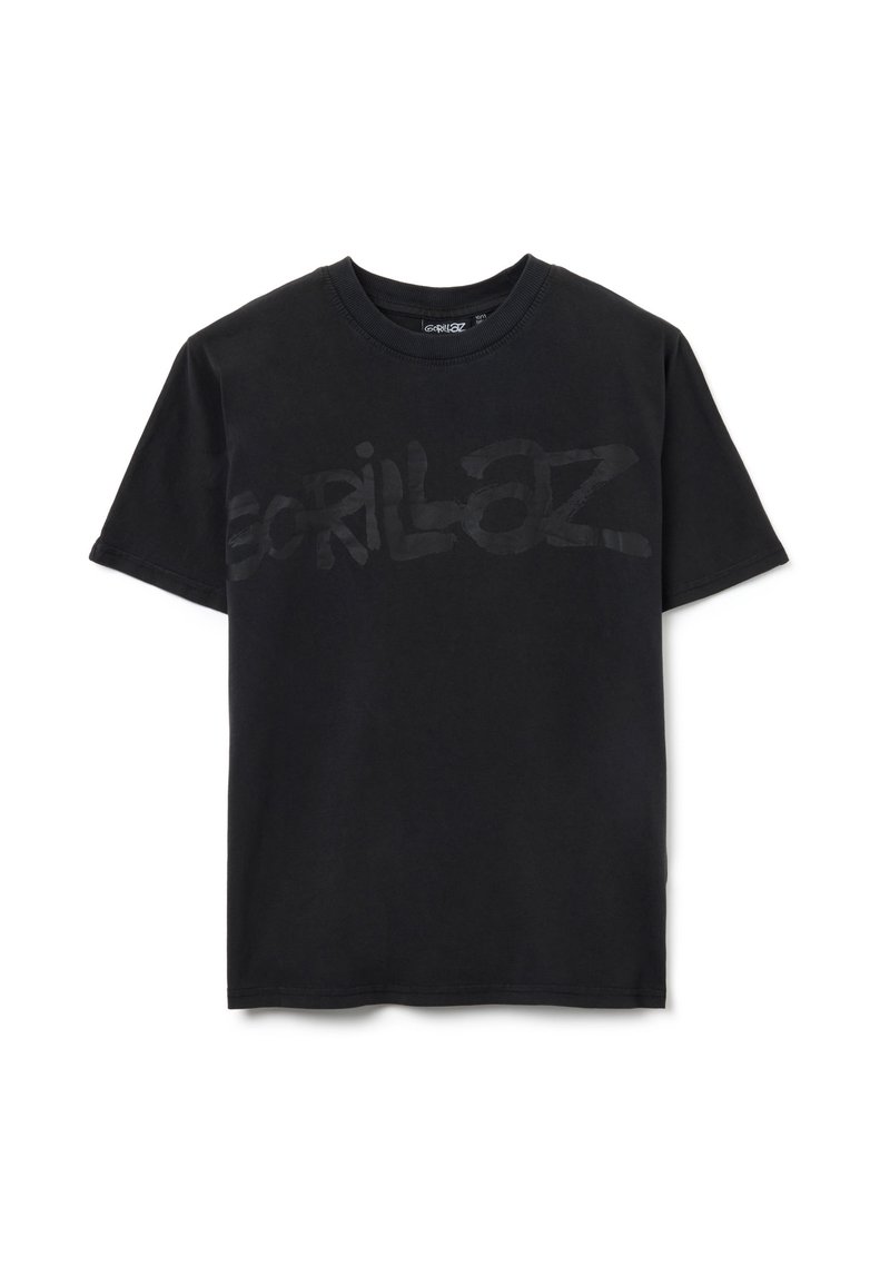 Zwarte katoenen t-shirt met een groot, semi-transparant "Gorillaz" logo aan de voorkant. Standaard ronde hals en korte mouwen, gladde textuur.