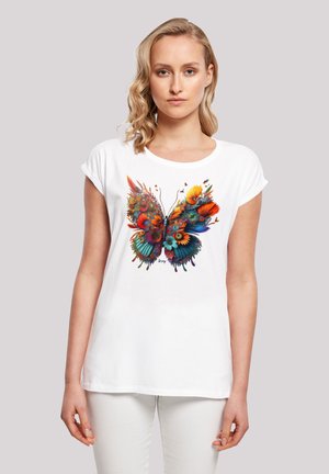White cotton t-shirt featuring a colorful butterfly graphic made of flowers, with accents of red, yellow, and blue. Short sleeves.