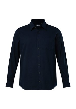 Langærmet, knap-op skjorte lavet af mørkeblå stof. Har krave, brystlomme og frontknaplukninger. Enkelt, ensfarvet design.