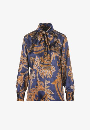 Navy blue blouse featuring a floral pattern in gold. Made of silky fabric, it has a high neckline with a tied bow and long sleeves.