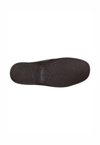 Suela de zapato de goma negra con patrones de agarre texturizados, con un logo circular en el centro y un borde liso.
