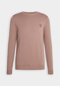 Pull mauve à manches longues, col rond, avec poignets et ourlet côtelés, présentant un petit logo d'oiseau jaune sur la poitrine gauche.
