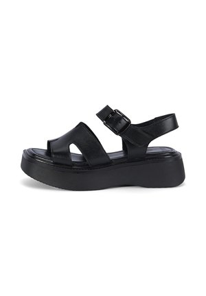 Sandale à plateforme en cuir noir avec semelle épaisse, bout ouvert, larges brides et bride de cheville réglable avec boucle.
