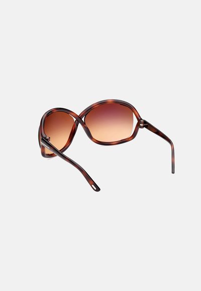 Braune Schildpatt-Sonnenbrille mit Gradienten-Gläsern, übergroßer ovaler Form und schlanken, geschwungenen Bügeln, die für einen sicheren Sitz sorgen.
