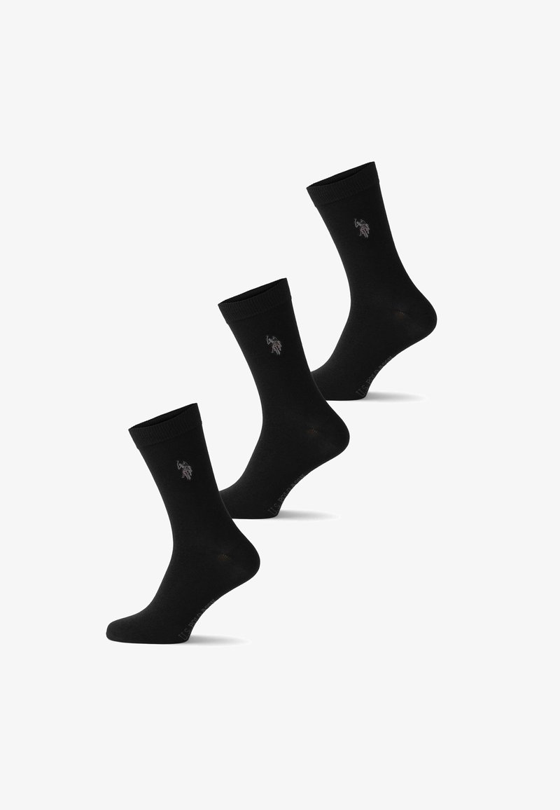 Trois chaussettes noires montant jusqu'au mollet avec un petit logo représentant un joueur de polo à cheval près du bord supérieur.