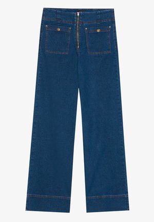 Bredde ben jeans i mørkeblå, med to baklommer med knapper, glidelås og kontrastsøm langs sømmene.