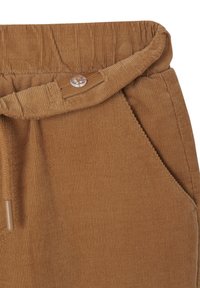 Brown corduroy pants with a textured surface, elastic waistband, button closure, and side pockets. Features vertical ribbing and a relaxed fit.