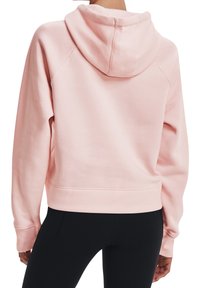 Sudadera rosa claro con capucha ajustable, puños acanalados y dobladillo texturizado. Presenta un corte relajado y un material de felpa suave.