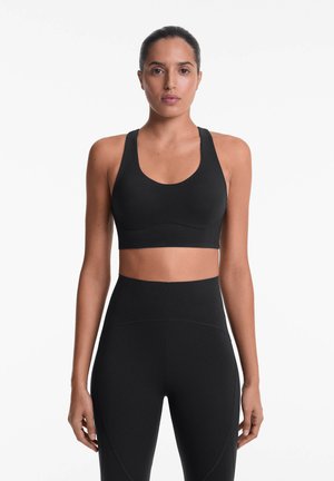 OYSHO MEDIUM-SUPPORT COMPRESSIVE WITH CUPS - Medium support sports bra - black