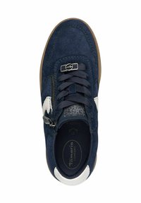 Navy blue suede sneaker featuring a white zigzag detail, textured insole, black laces, and a side zipper with metal accents.