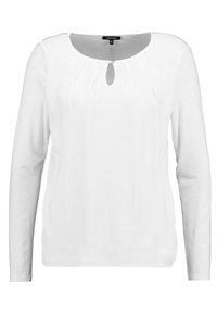 Vit blus med långa ärmar i mjukt tyg som har en rund halsringning med en nyckelhålsdetalj i mitten och subtila veck fram. 