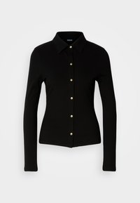 Zwarte geribbelde shirt met lange mouwen en een kraag, voorzien van gouden knopen aan de voorkant en een getailleerde pasvorm.