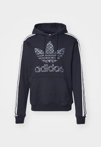 Sweat à capuche noir en mélange de coton, avec un grand logo graphique texturé, une poche kangourou et des bandes blanches sur les côtés des manches.