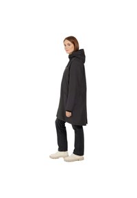 Black waterproof coat with a hood, long sleeves, and front zip. Features pockets and a slightly tapered silhouette, paired with dark jeans and light shoes.
