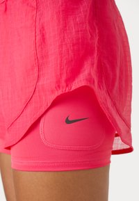 Nike Performance Sportiniai šortai - aster pink