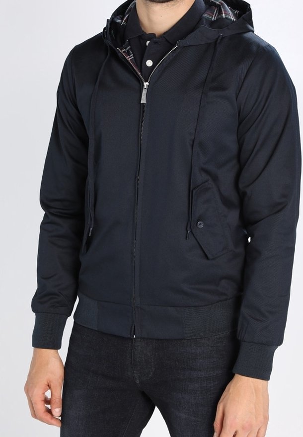 Navy zip-up jacket with a hood, featuring a textured fabric, side pockets, and a plaid interior lining. Ribbed cuffs and waistband.