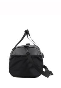 Sac de sport noir avec un revêtement synthétique texturé, de forme arrondie, une bandoulière ajustable et une poignée supérieure pour différentes options de transport.