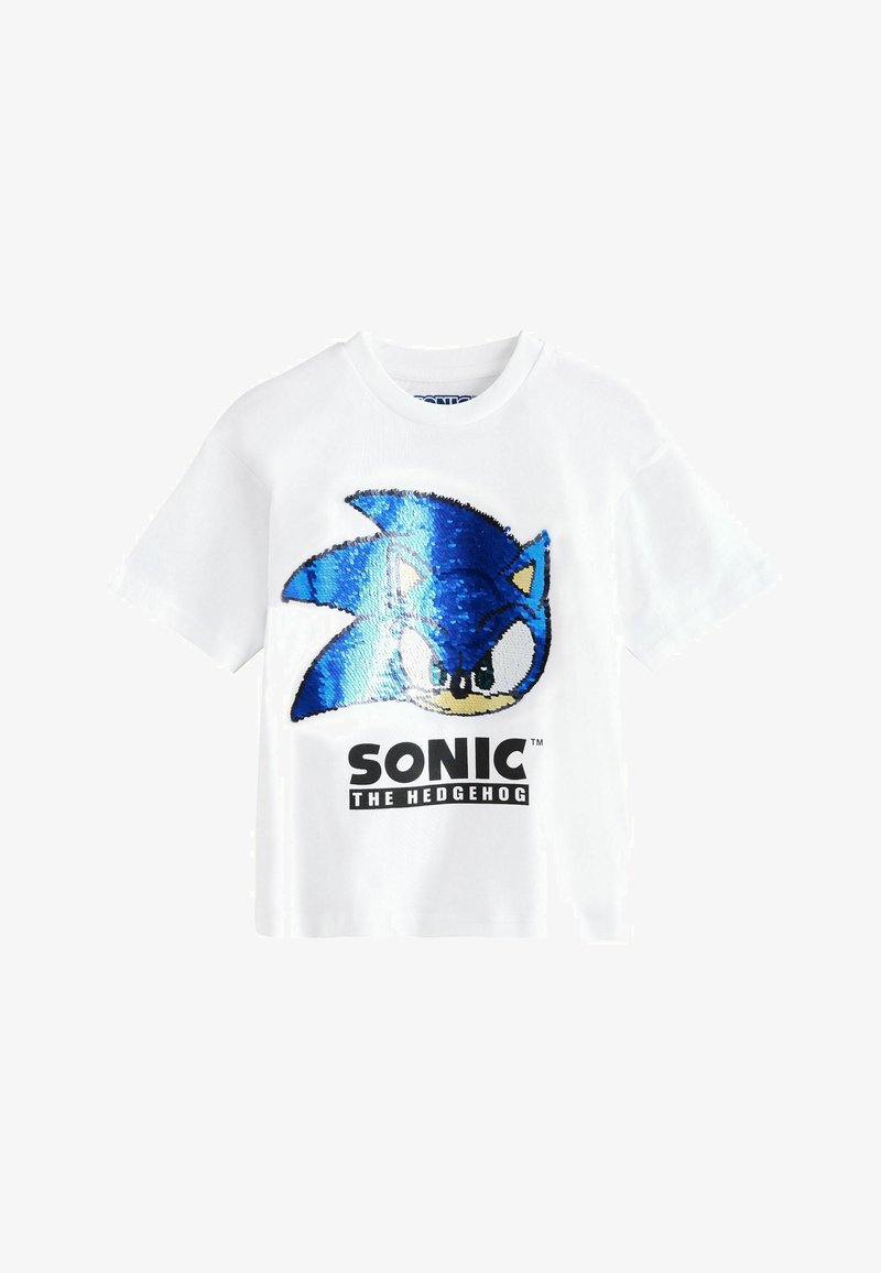 White short-sleeve T-shirt with a blue sequined Sonic the Hedgehog face and black text reading "SONIC THE HEDGEHOG" on the front.