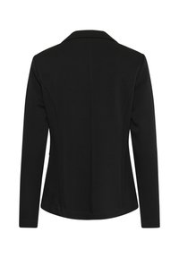 Blazer noir cintré avec un col cranté, des manches longues et une silhouette ajustée. Texture lisse avec un design de dos épuré.