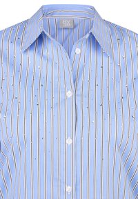 Light blue button-up shirt with vertical white and black stripes, featuring scattered rhinestone accents and a pointed collar.
