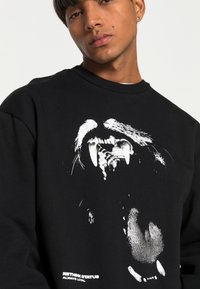 Rethink Stat UNISEX - Camisola - black