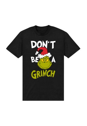 Camiseta negra de algodón que muestra un Grinch verde de estilo caricaturesco con un sombrero rojo de Santa, con texto en negrita blanco y verde: "NO SEAS UN GRINCH."