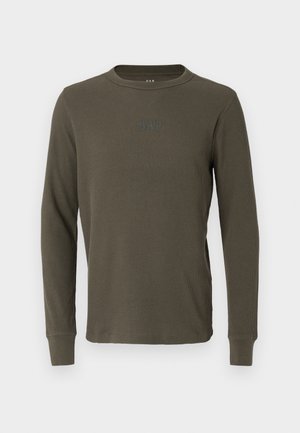 Pikkade varrukatega oliivroheline ribatatud t-särk ümarate kaelustega ja peene GAP logo rinnal. Pehme tekstuur ja sobiv disain.