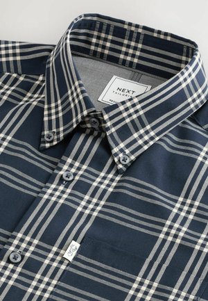 Navy blue plaid shirt featuring light beige stripes, button-down collar, and two buttons on the front. Material has a textured finish.