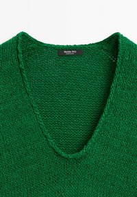 Green knitted v-neck sweater with a Massimo Dutti brand label inside the collar, made in China.