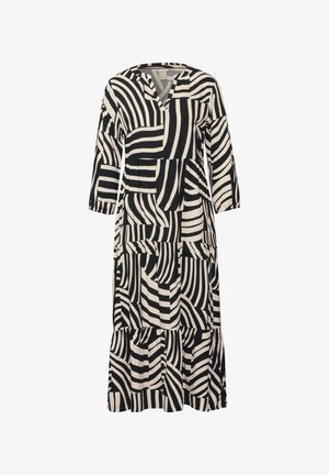 Černé a krémové šaty s výstřihem do V, dlouhými rukávy a řaseným designem. Obsahují abstraktní pruhované vzory v různých šířkách a orientacích.