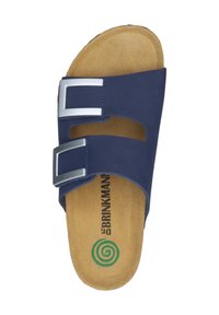 Navy blue flat sandal with two adjustable silver buckle straps, soft cushioned footbed, and a textured tan sole featuring a green spiral logo.