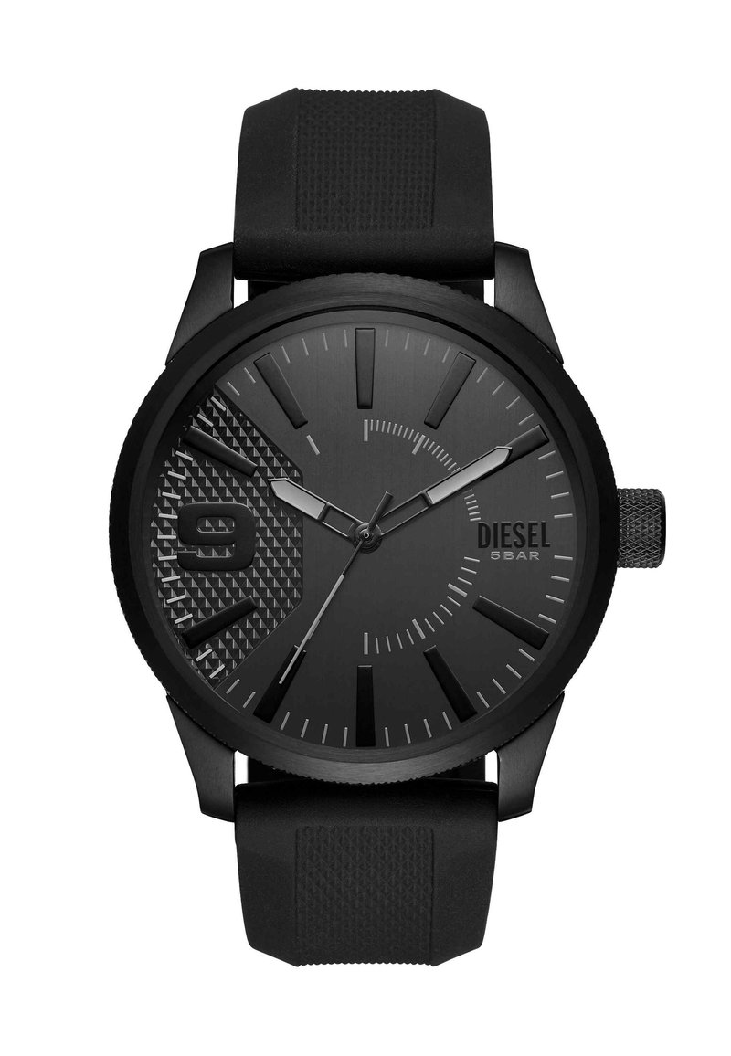 Black Diesel wristwatch with textured dial section, large number 9, three hands, and black silicone strap.